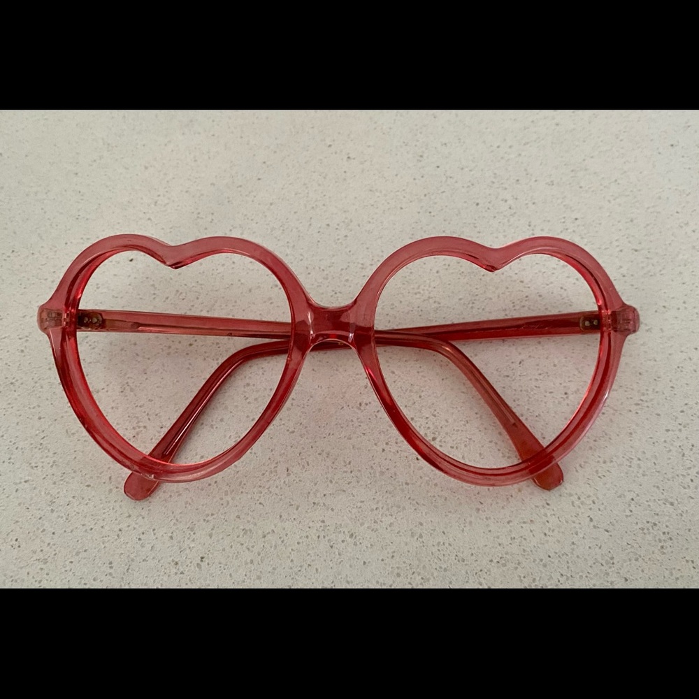 A super cute pair of vintage heart shaped glasses frame. Dorky and unique!